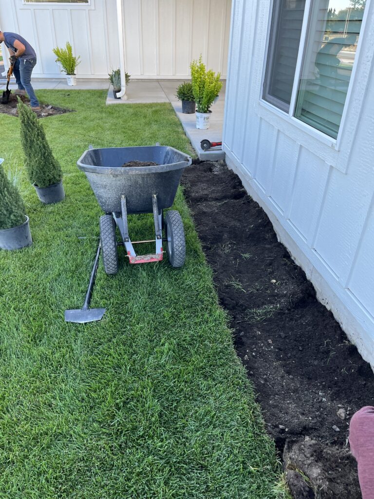 Fresh mulch and planting beds showing Landscaping in Whitefish, MT around a well-kept residential property