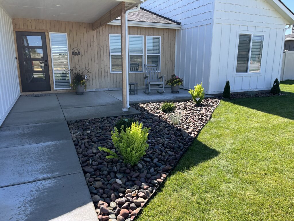 Professional Tree Trimming in Lakeside, MT around a well-kept residential property with trimmed branches and cleaner curb appeal